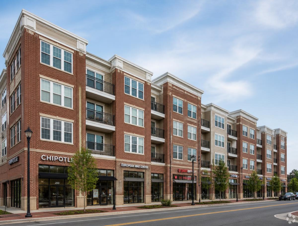 Brick multi-family apartment building with ground-floor commercial retail